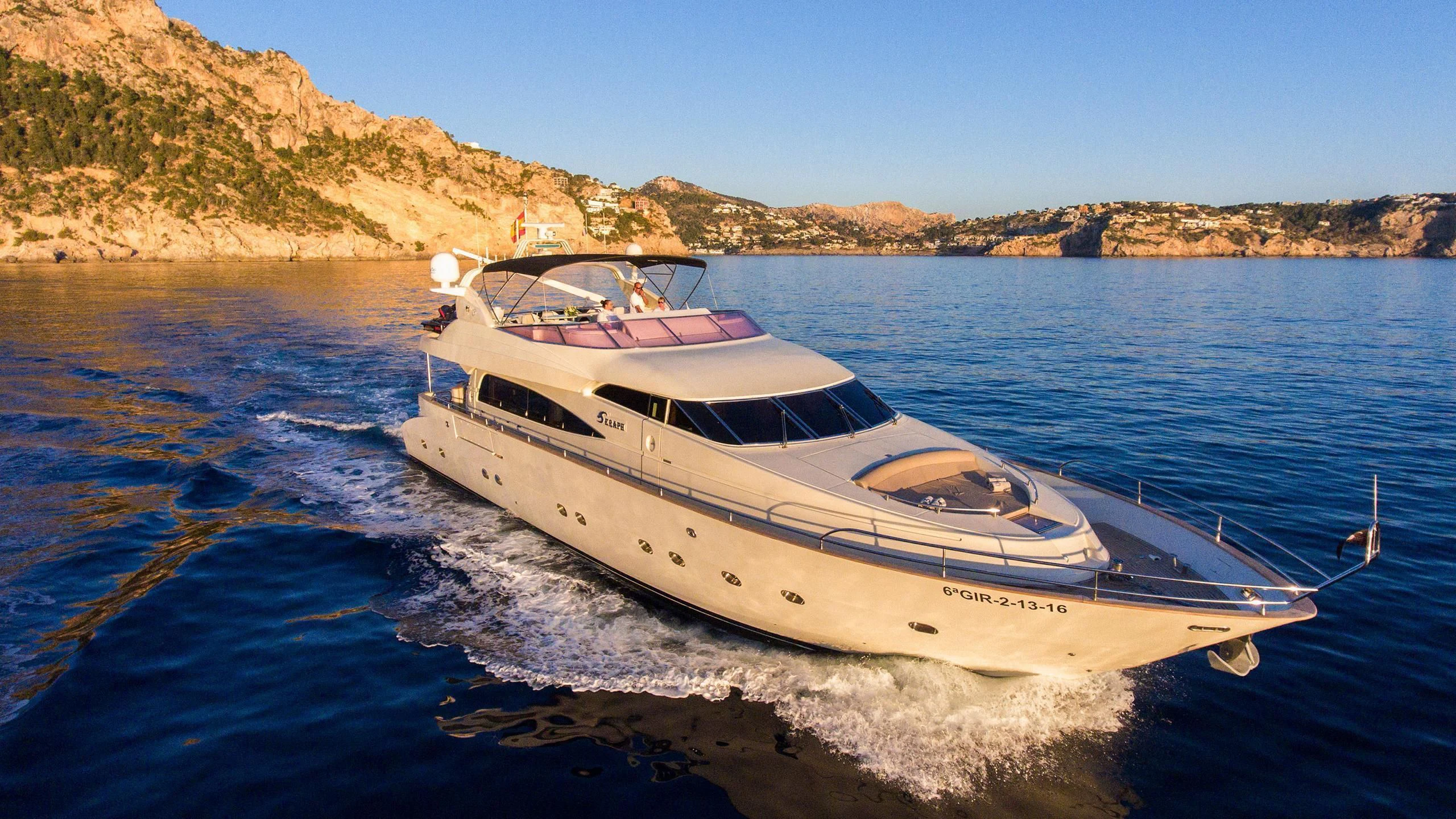 a white yacht on the water aboard SERAPH PRIMERO Yacht for Sale