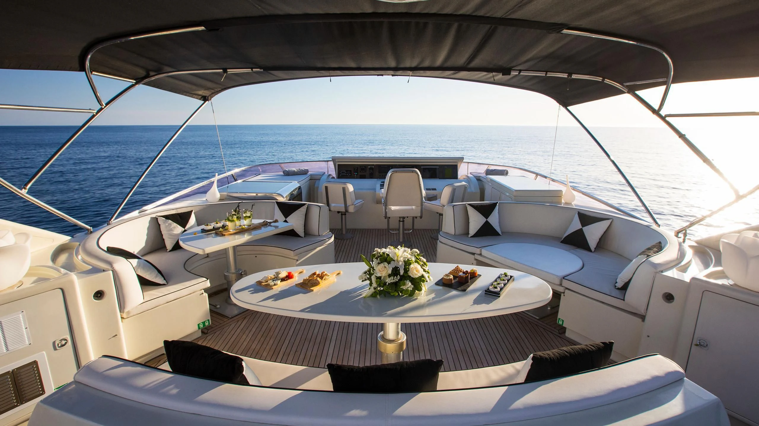 a yacht with a table set for a dinner party aboard SERAPH PRIMERO Yacht for Sale