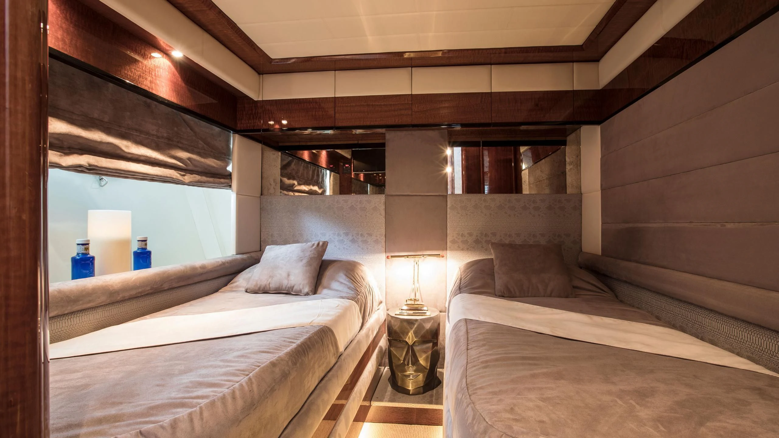 a room with beds and a window aboard SERAPH PRIMERO Yacht for Sale