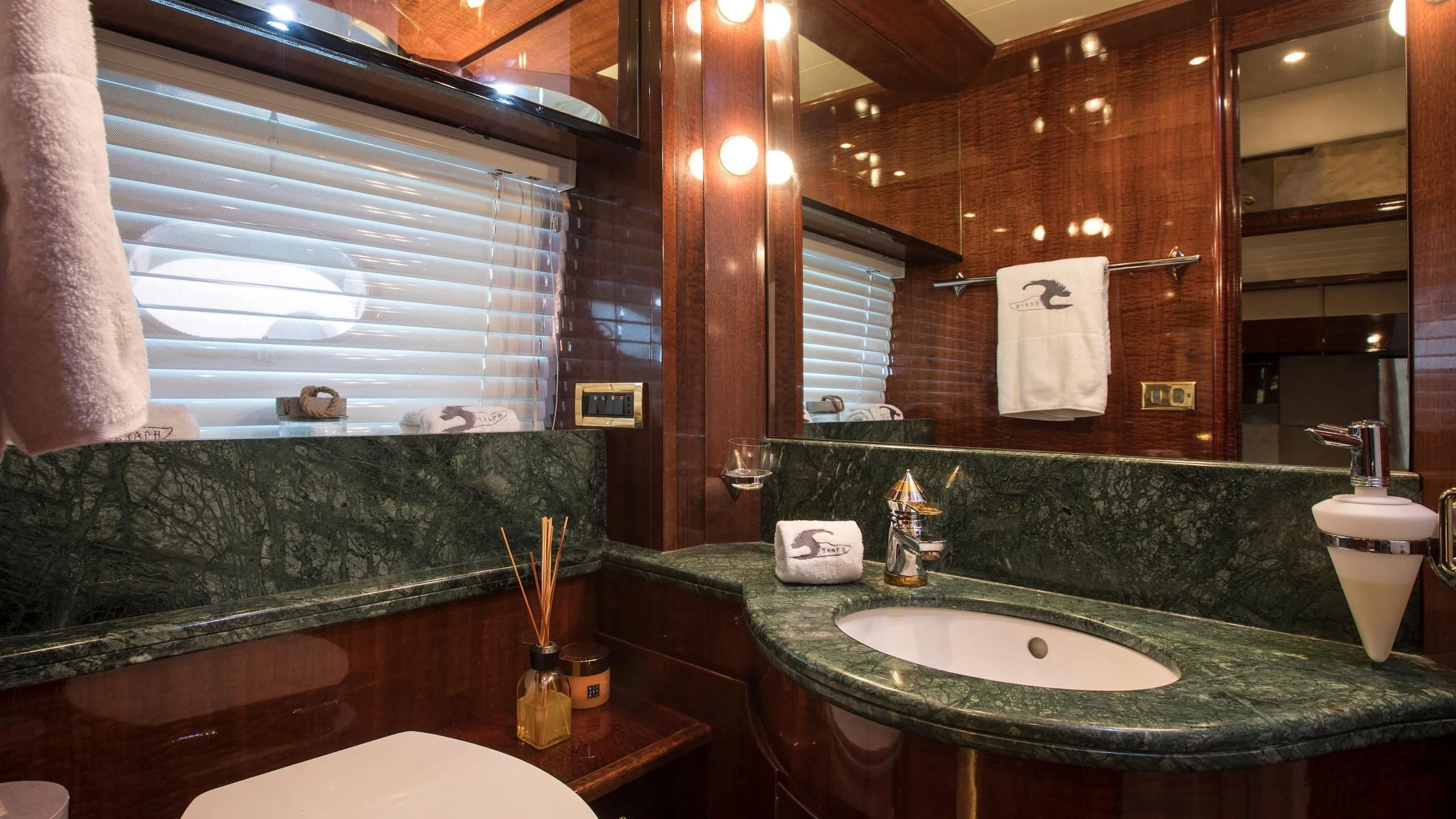 a bathroom with a large mirror aboard SERAPH PRIMERO Yacht for Sale