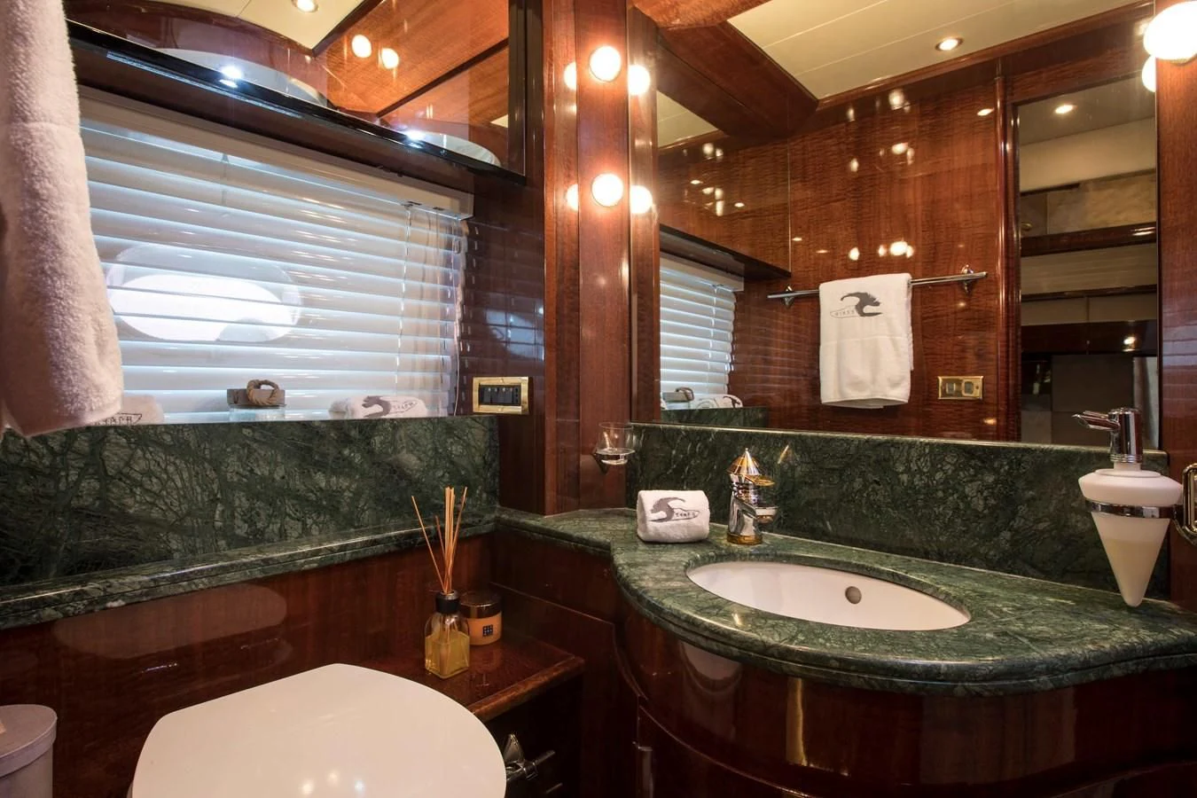 a bathroom with a large mirror aboard SERAPH PRIMERO Yacht for Sale
