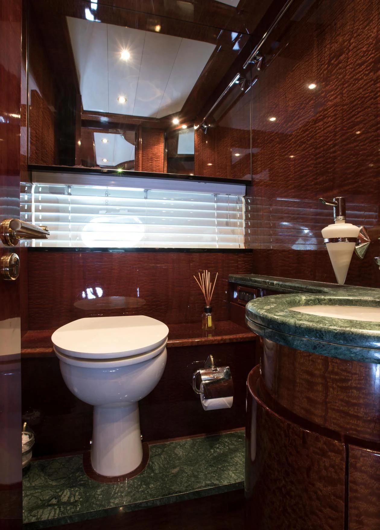 a bathroom with a toilet and a sink aboard SERAPH PRIMERO Yacht for Sale