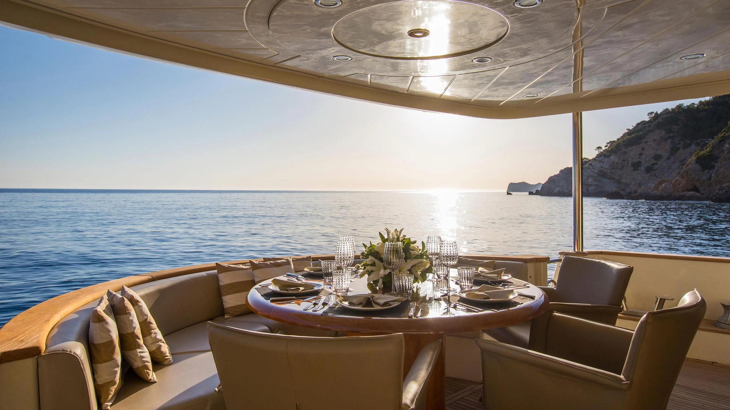 a table set for a meal on a boat aboard SERAPH PRIMERO Yacht for Sale