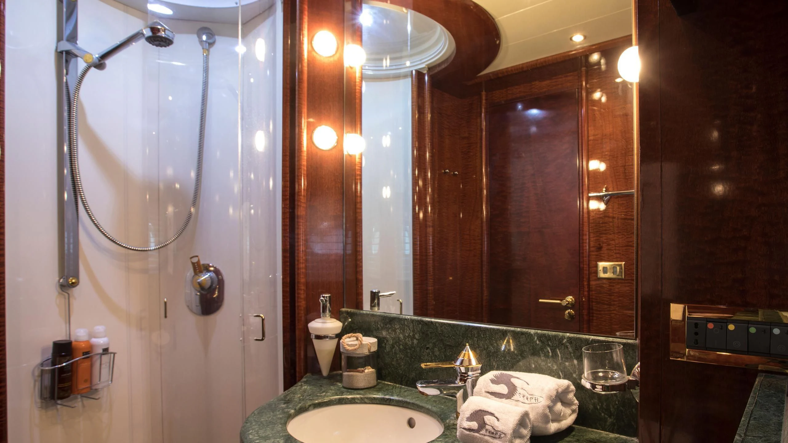 a bathroom with a large mirror aboard SERAPH PRIMERO Yacht for Sale