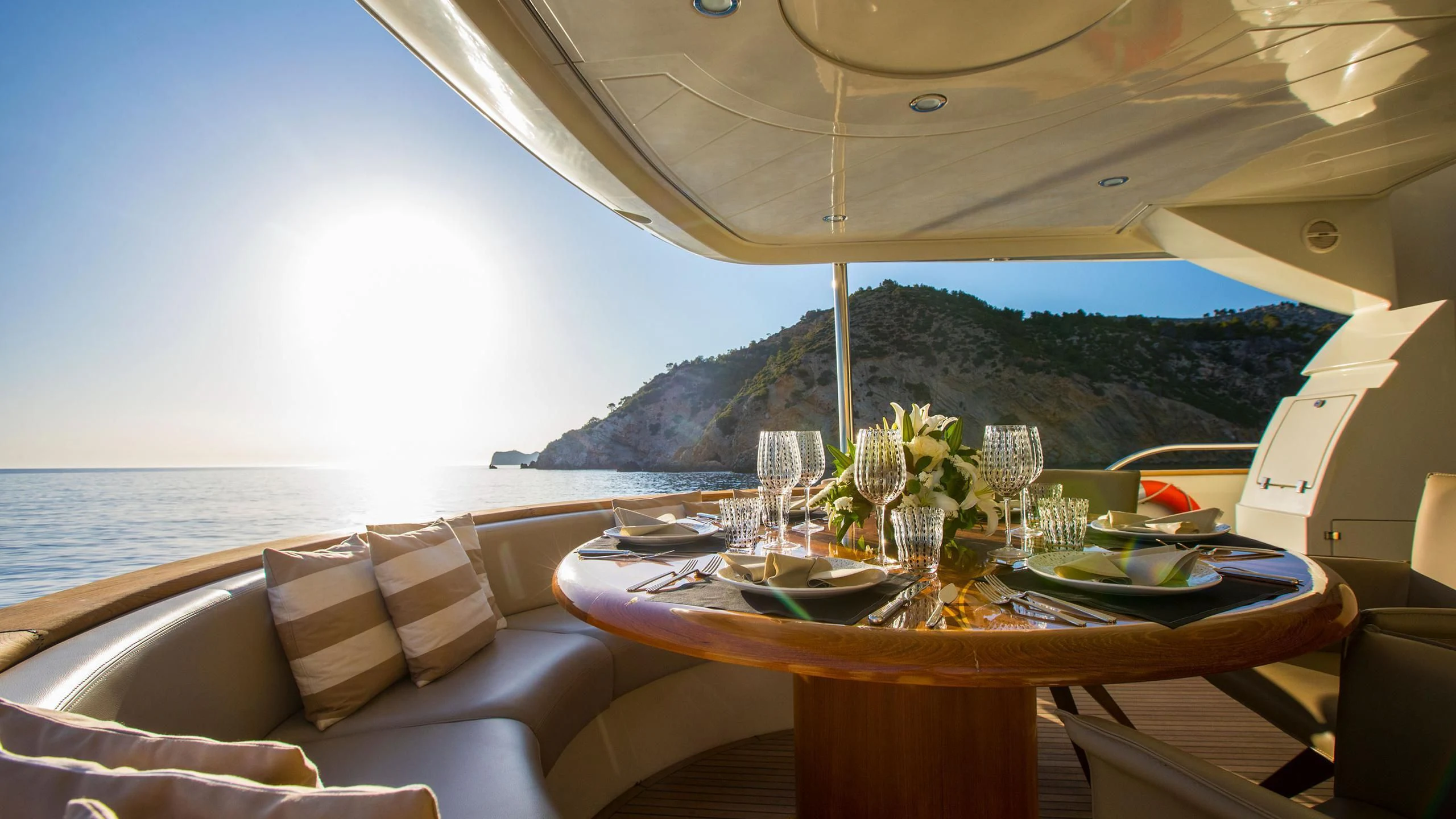 a table set for a meal on a boat aboard SERAPH PRIMERO Yacht for Sale