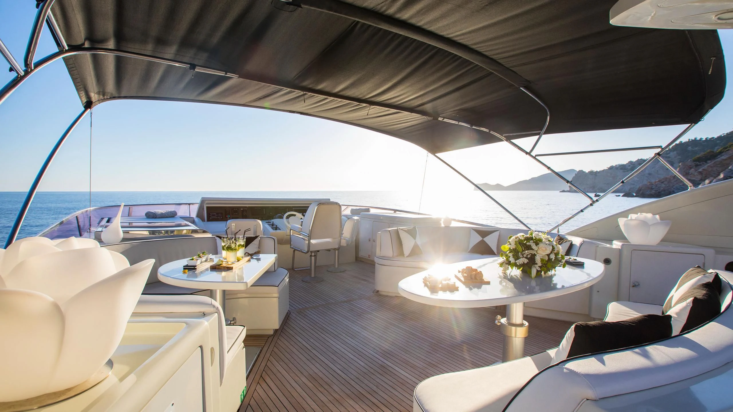 a boat with a table and chairs aboard SERAPH PRIMERO Yacht for Sale