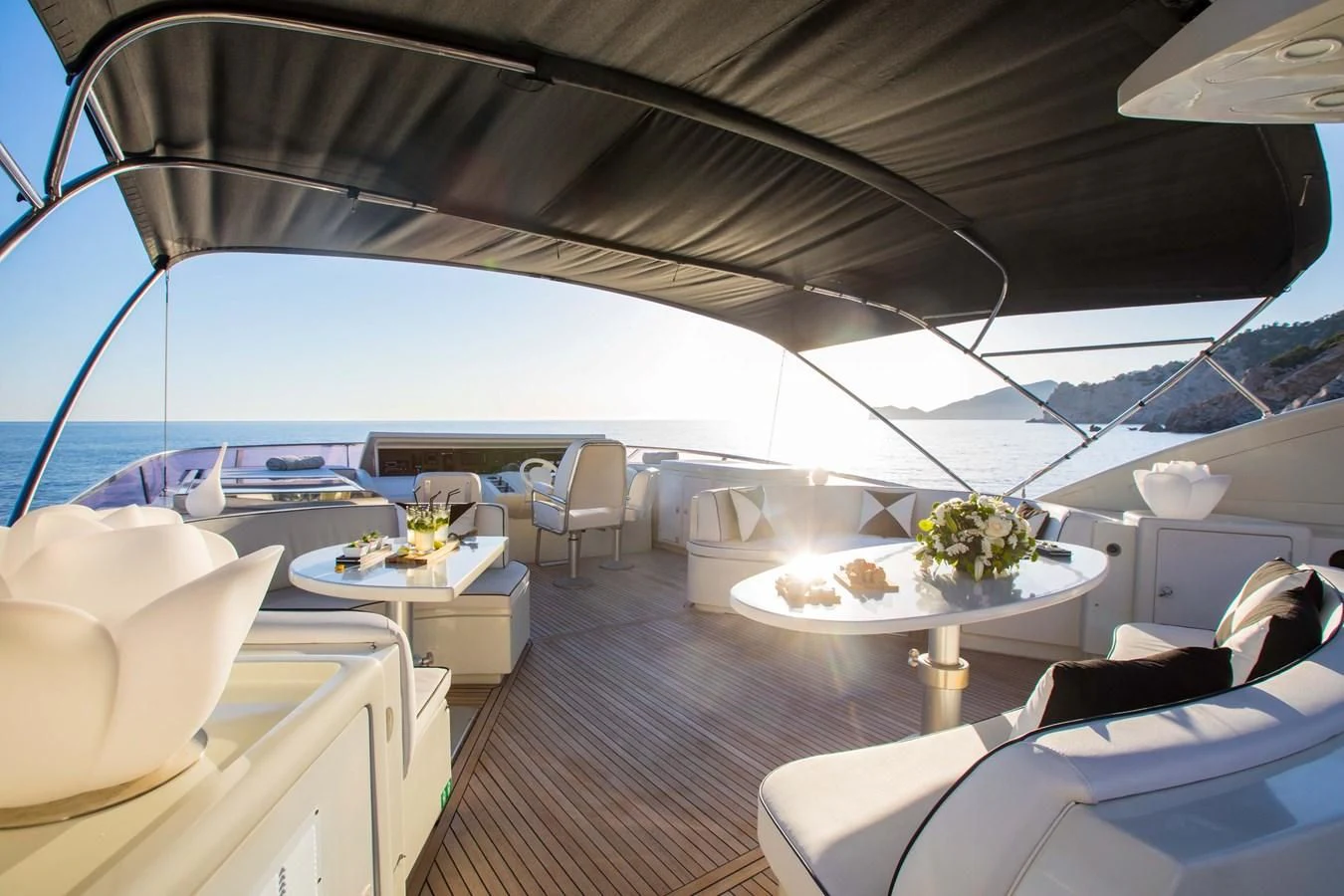 a boat with a table and chairs aboard SERAPH PRIMERO Yacht for Sale