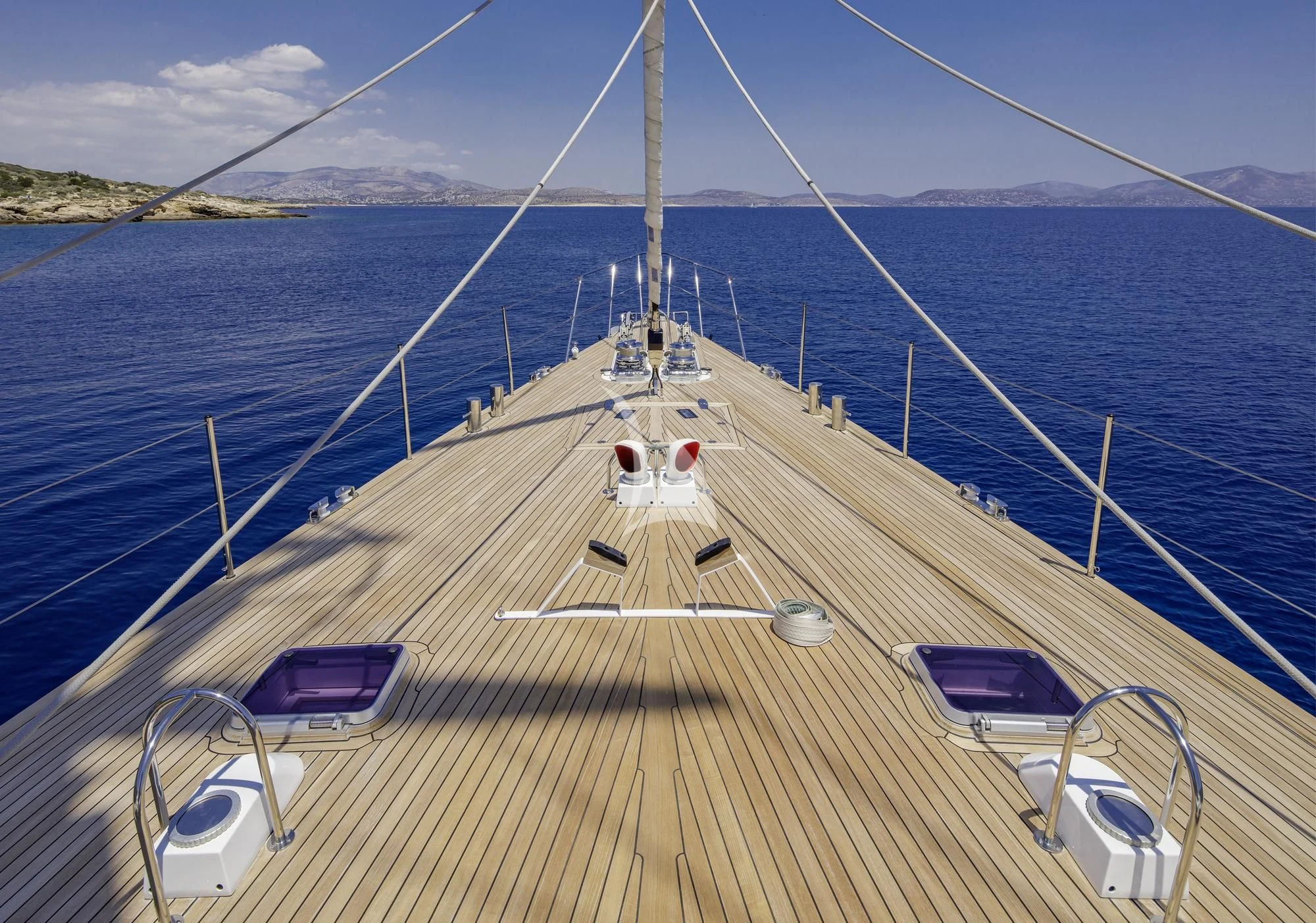 a long wooden bridge over water aboard NOMMO Yacht for Sale