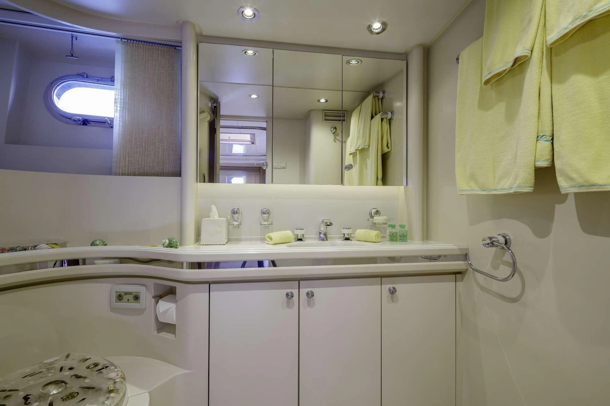 a bathroom with a large mirror aboard NOMMO Yacht for Sale