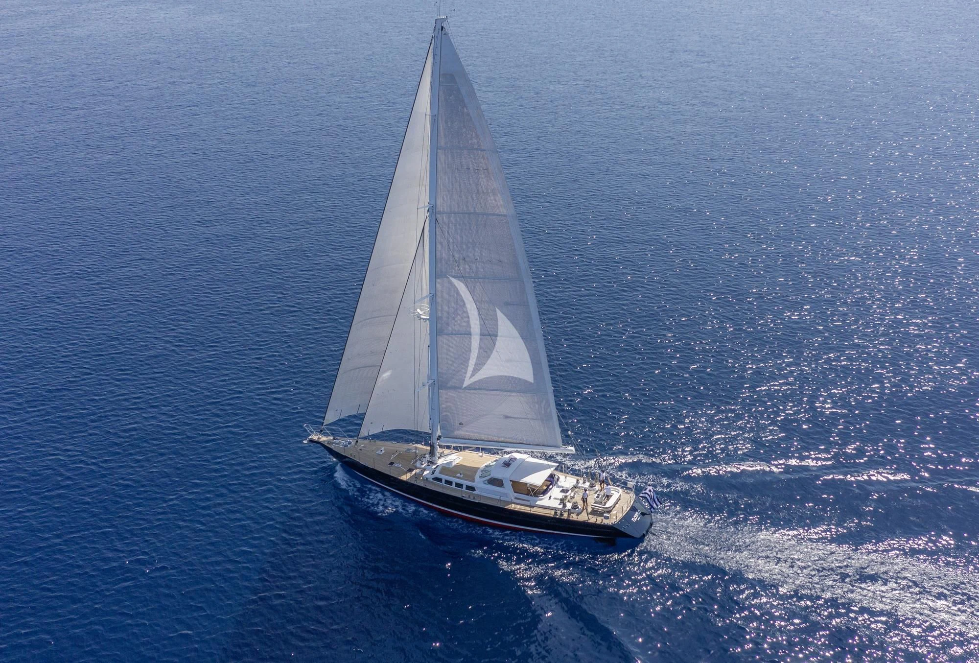 a sailboat on the water aboard NOMMO Yacht for Sale