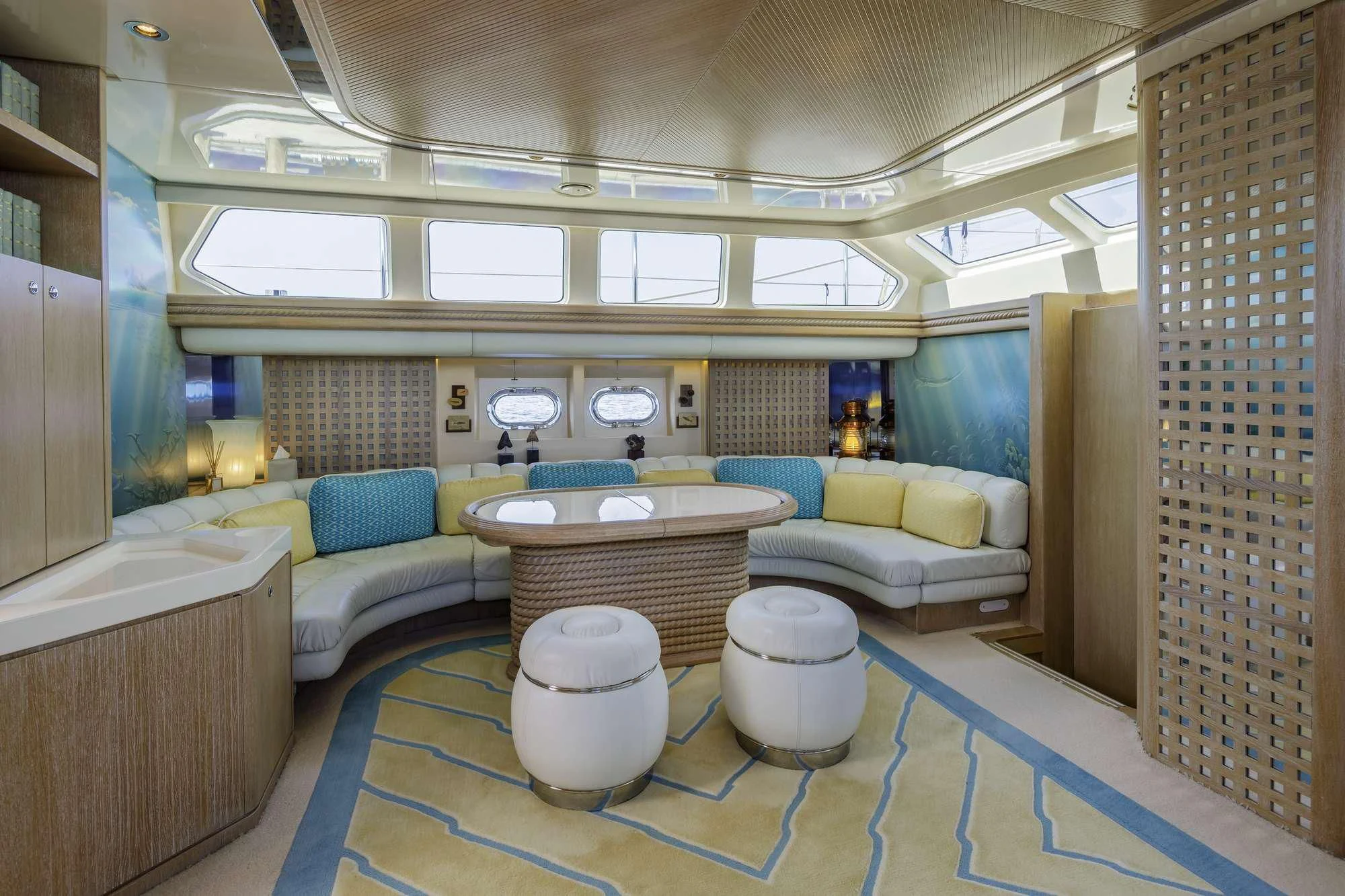 a room with a table and chairs aboard NOMMO Yacht for Sale
