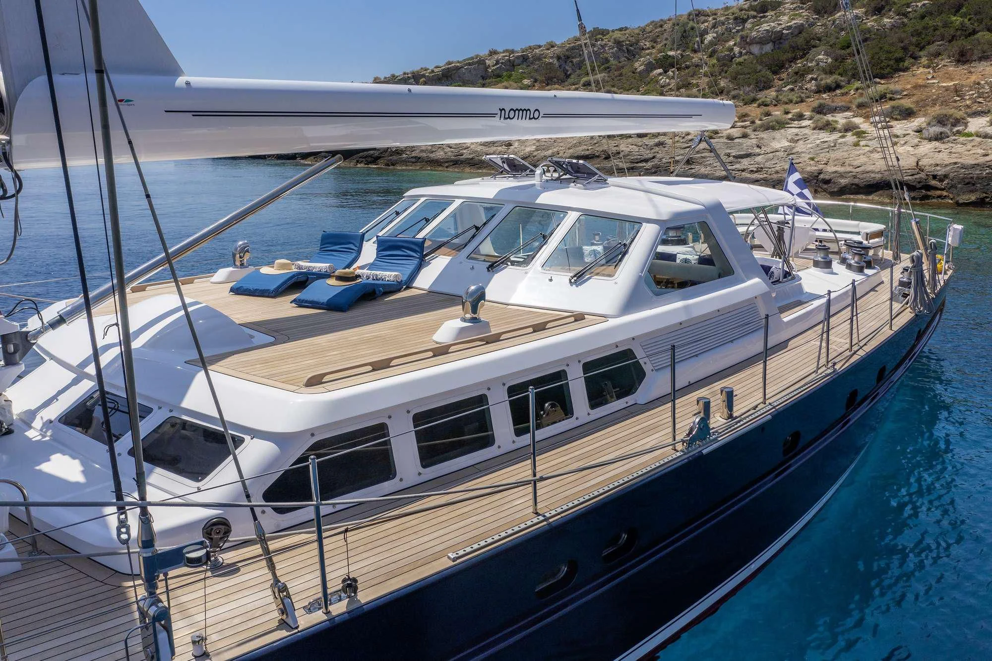 a boat docked at a pier aboard NOMMO Yacht for Sale