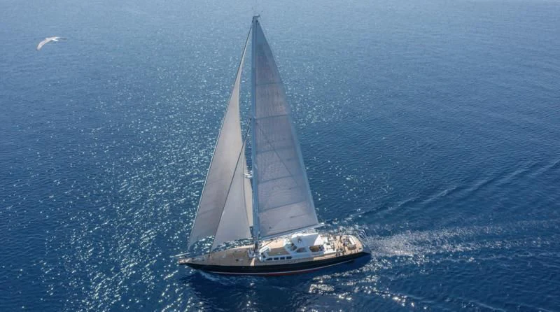 a sailboat in the ocean aboard NOMMO Yacht for Sale