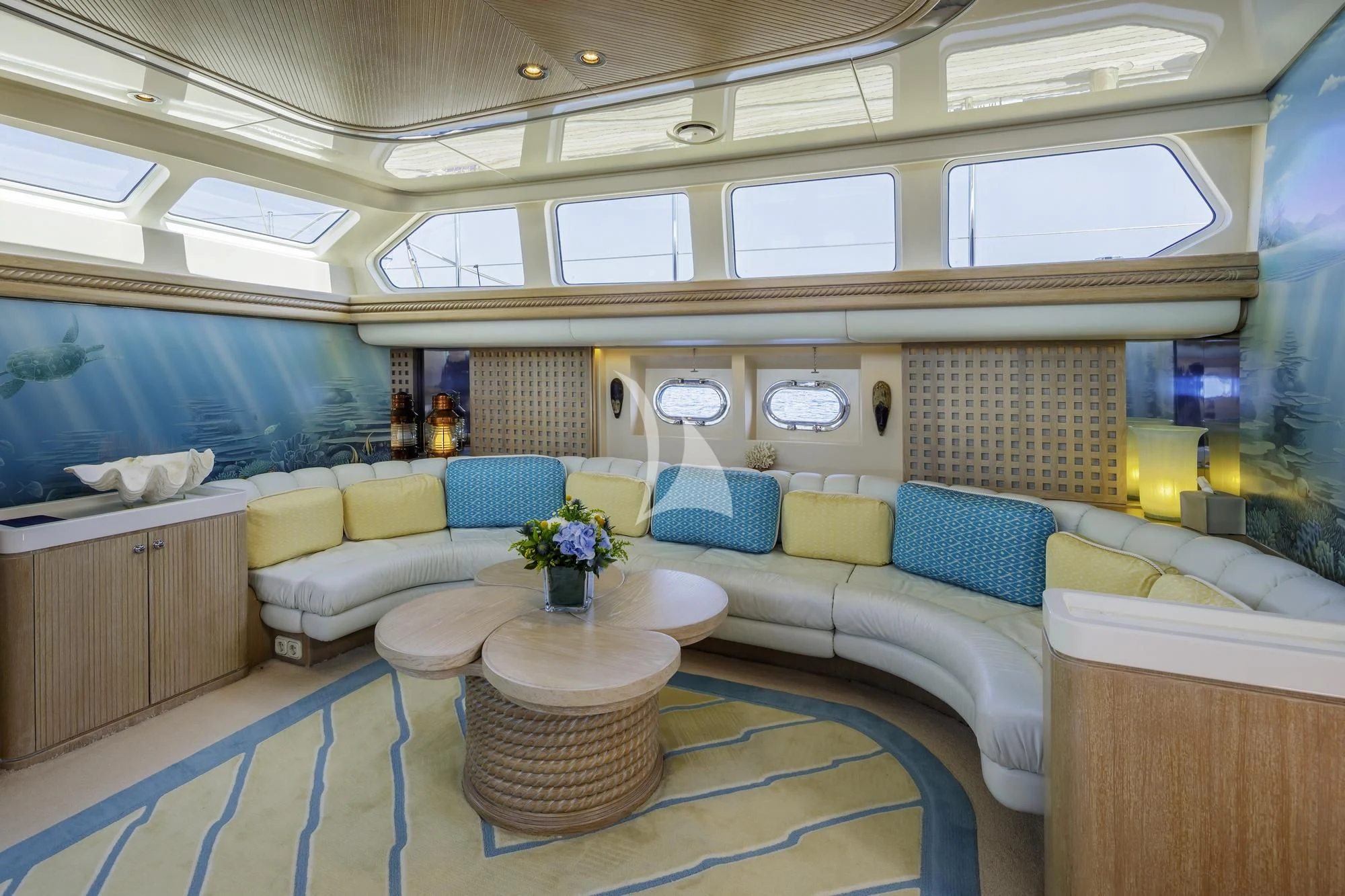 a room with a couch and a table aboard NOMMO Yacht for Sale