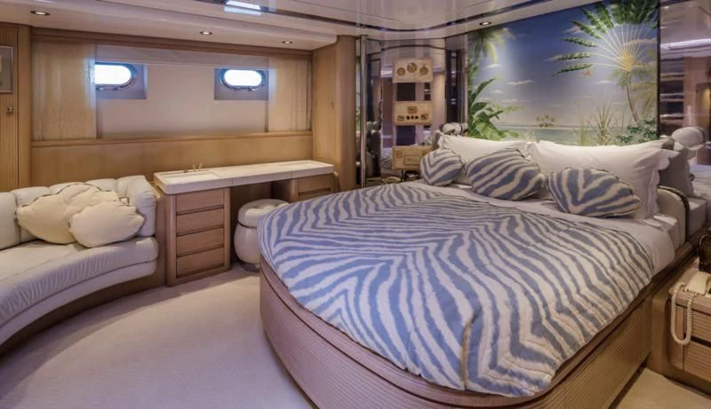 a room with a bed and a desk aboard NOMMO Yacht for Sale