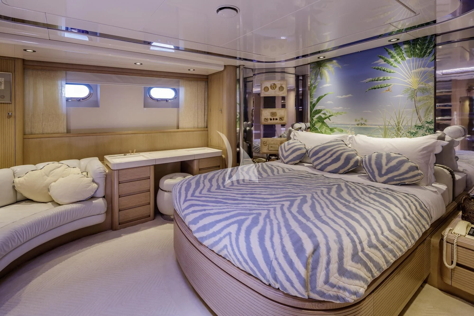 a room with a bed and a desk aboard NOMMO Yacht for Sale