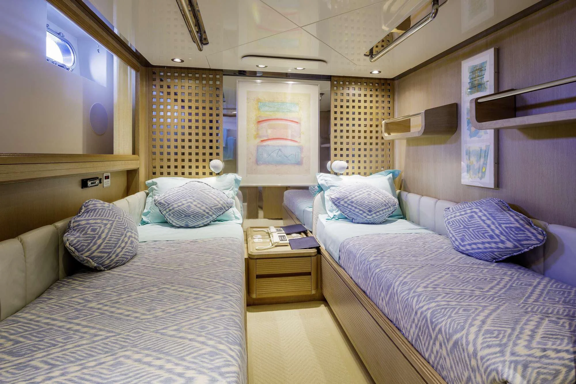 a couple of beds in a hotel room aboard NOMMO Yacht for Sale