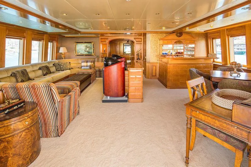 a living room with a fireplace aboard VITA NOVA Yacht for Sale