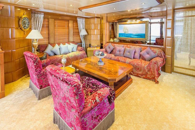 a living room with a couch and a tv aboard VITA NOVA Yacht for Sale