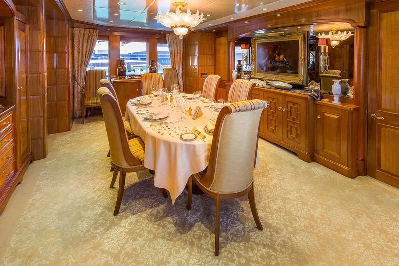 a dining room with a table and chairs aboard VITA NOVA Yacht for Sale