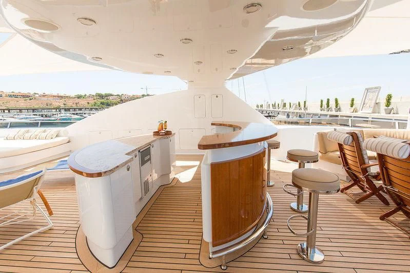 a room with a table and chairs aboard VITA NOVA Yacht for Sale