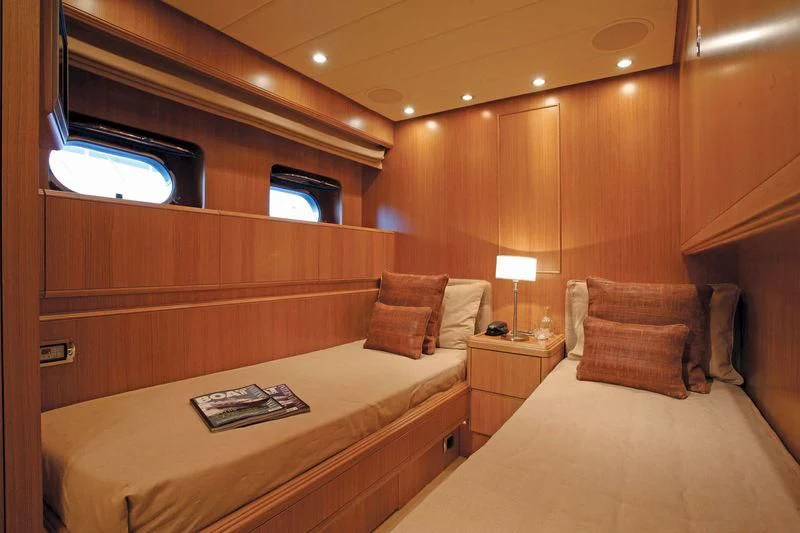 a room with a bed and a desk aboard SERALIN Yacht for Sale