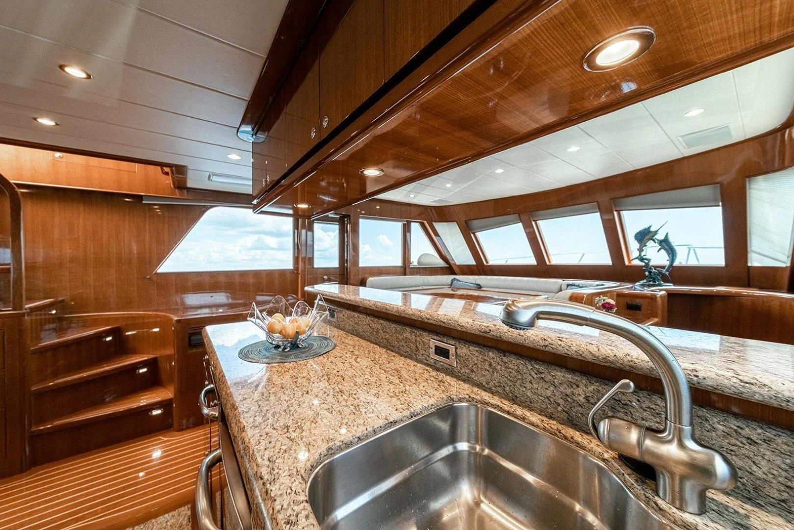 a kitchen with wooden cabinets aboard DREAM CATCHER Yacht for Sale
