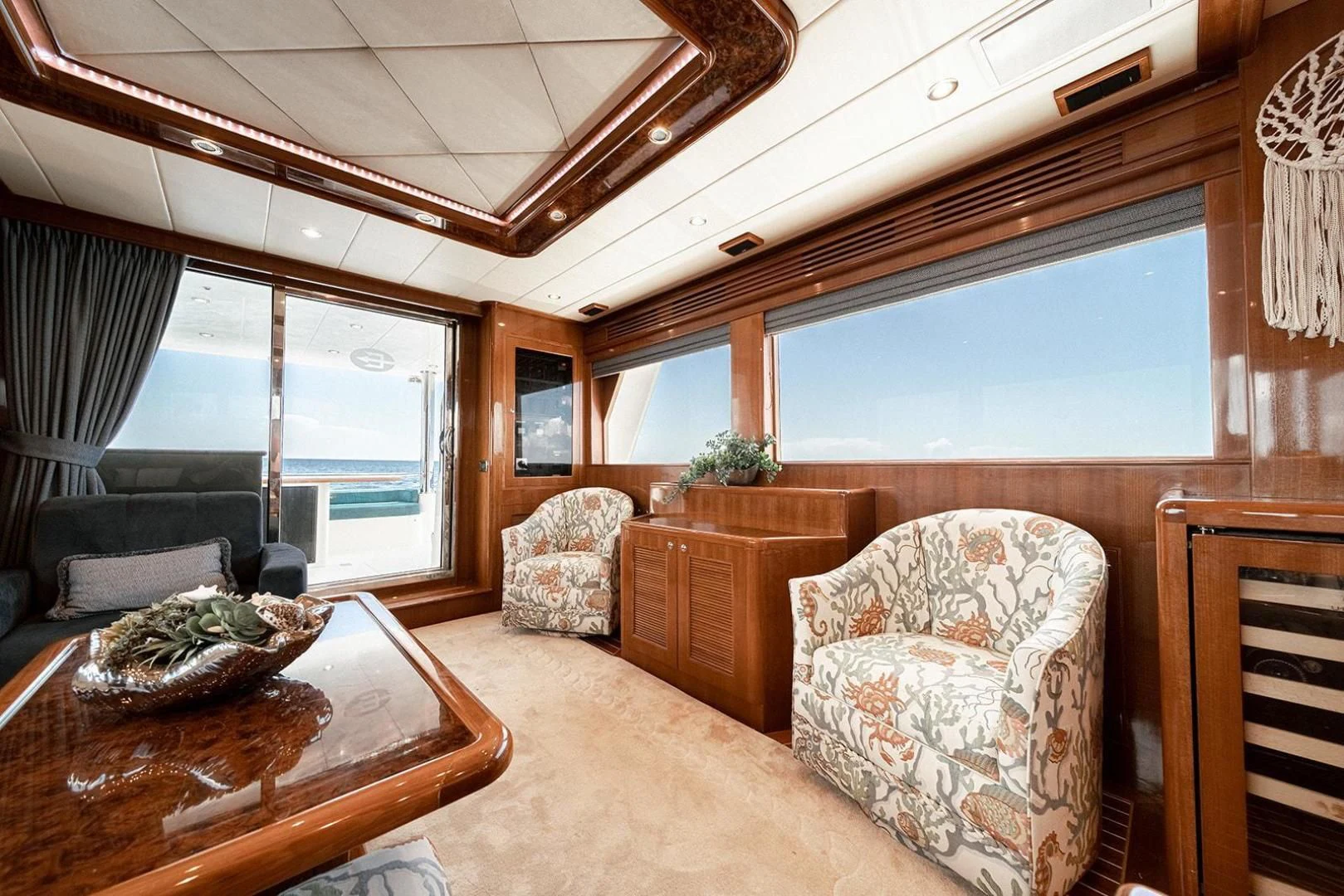 a living room with a large window aboard DREAM CATCHER Yacht for Sale