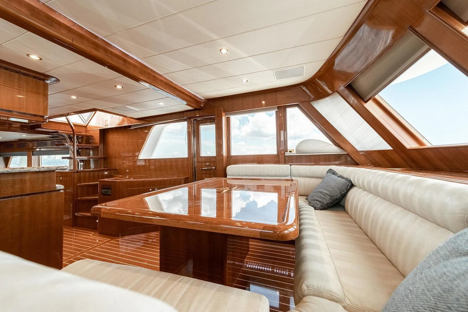 a cabin with a bed and a table aboard DREAM CATCHER Yacht for Sale