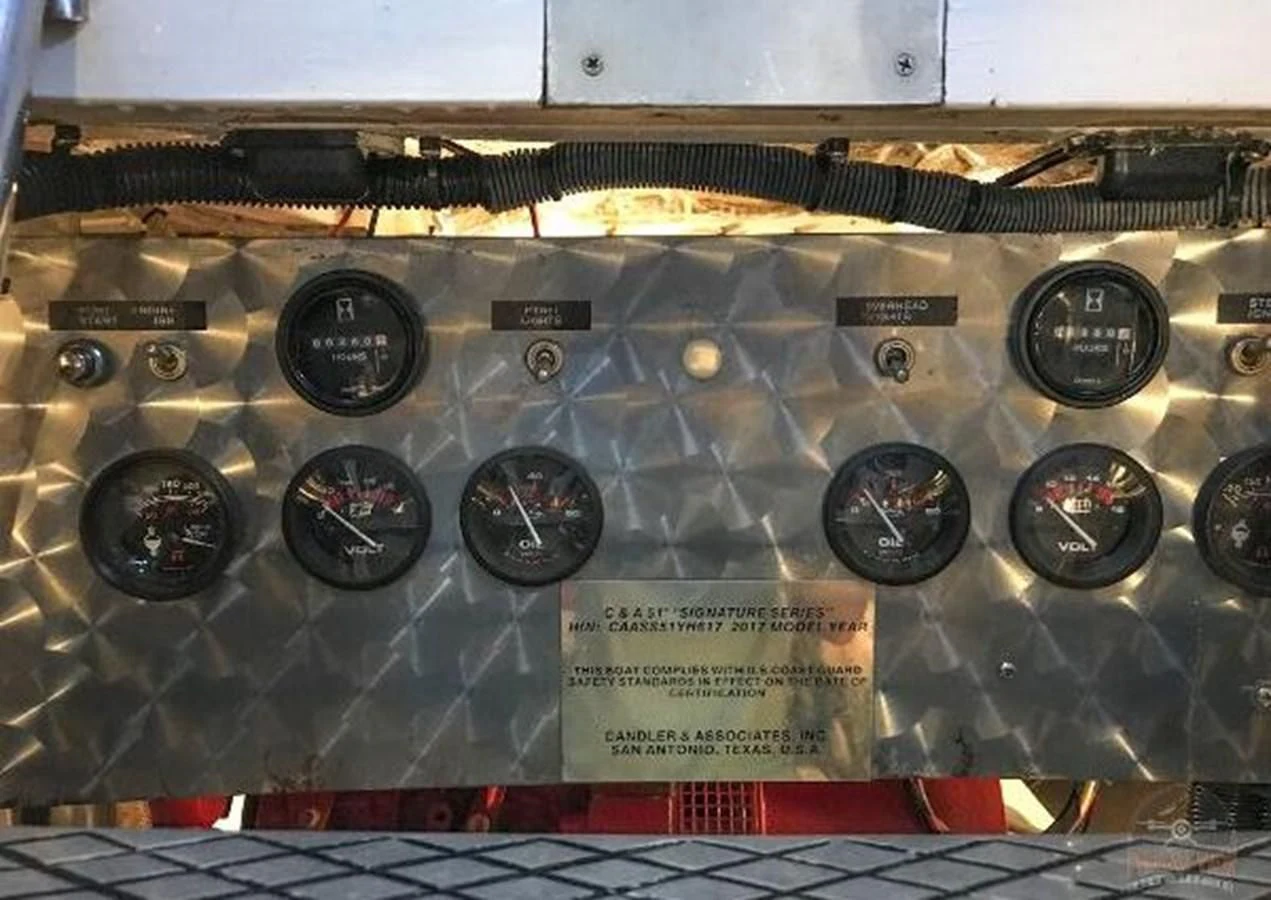 a group of black and silver radio drives on a shelf aboard DREAM CATCHER Yacht for Sale