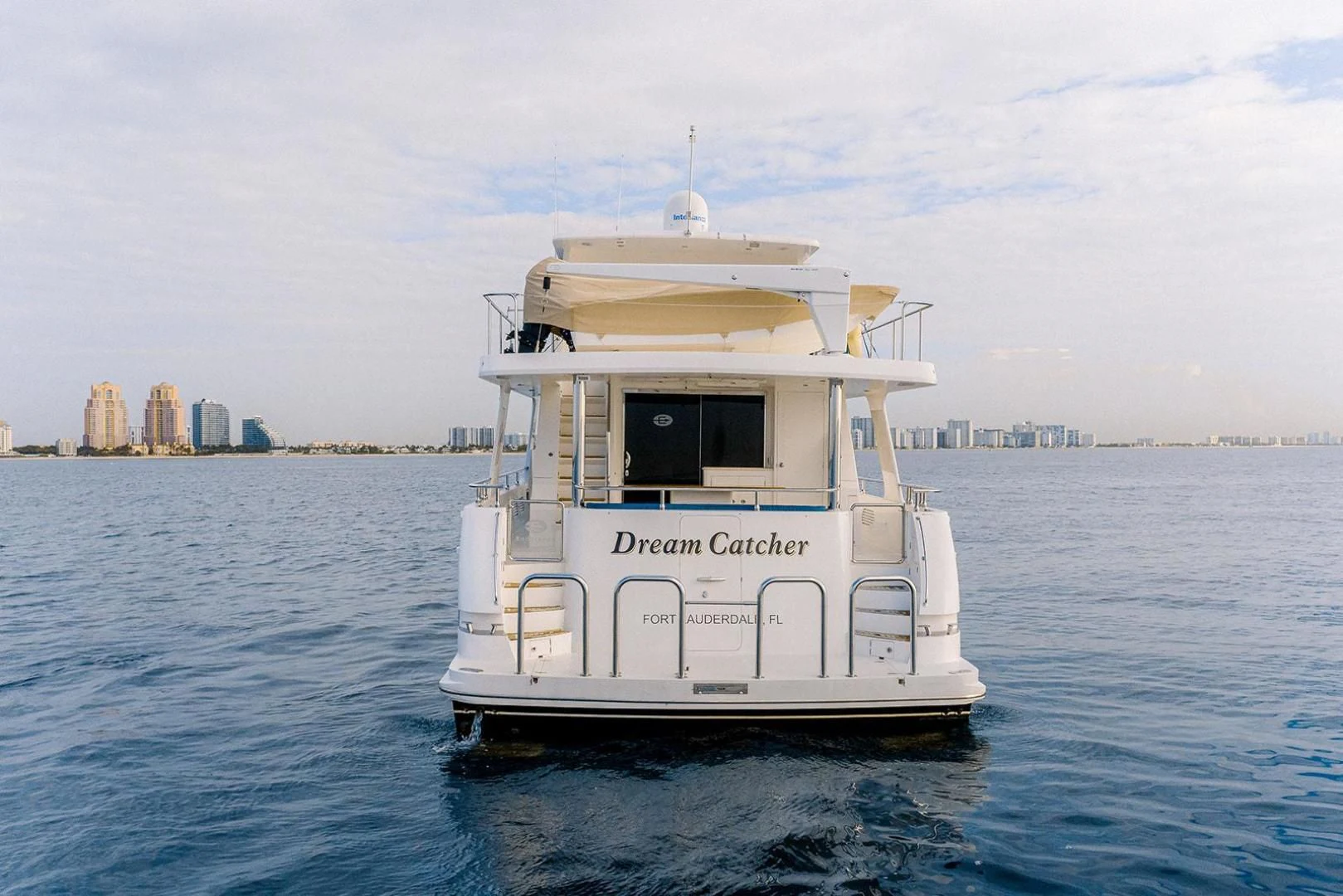 a white boat in the water aboard DREAM CATCHER Yacht for Sale