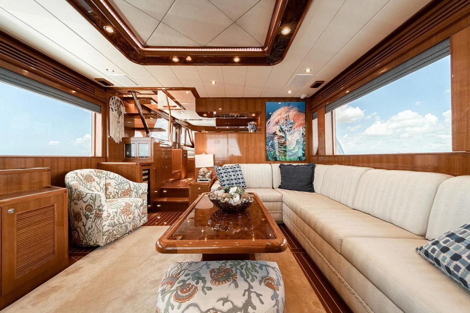a living room with a large window aboard DREAM CATCHER Yacht for Sale