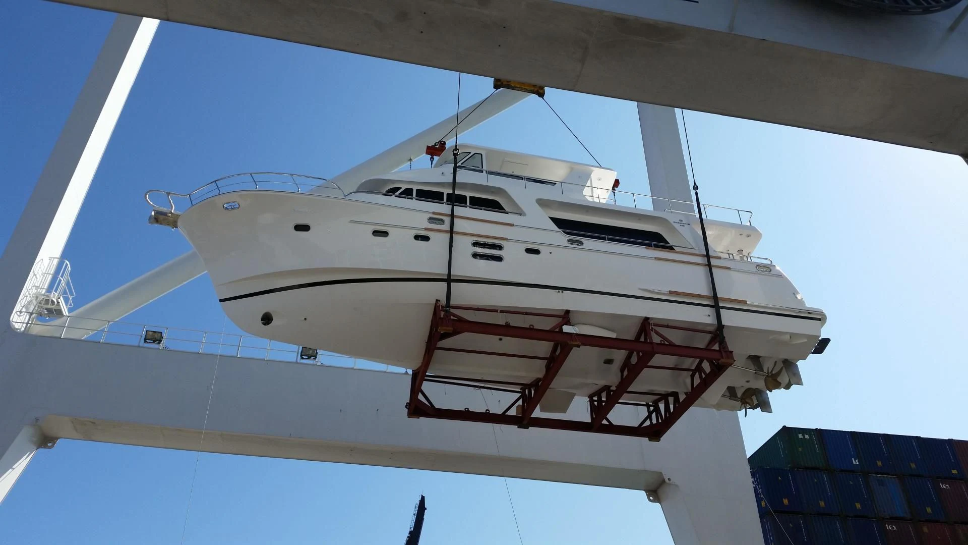 a white yacht on a dock aboard DREAM CATCHER Yacht for Sale