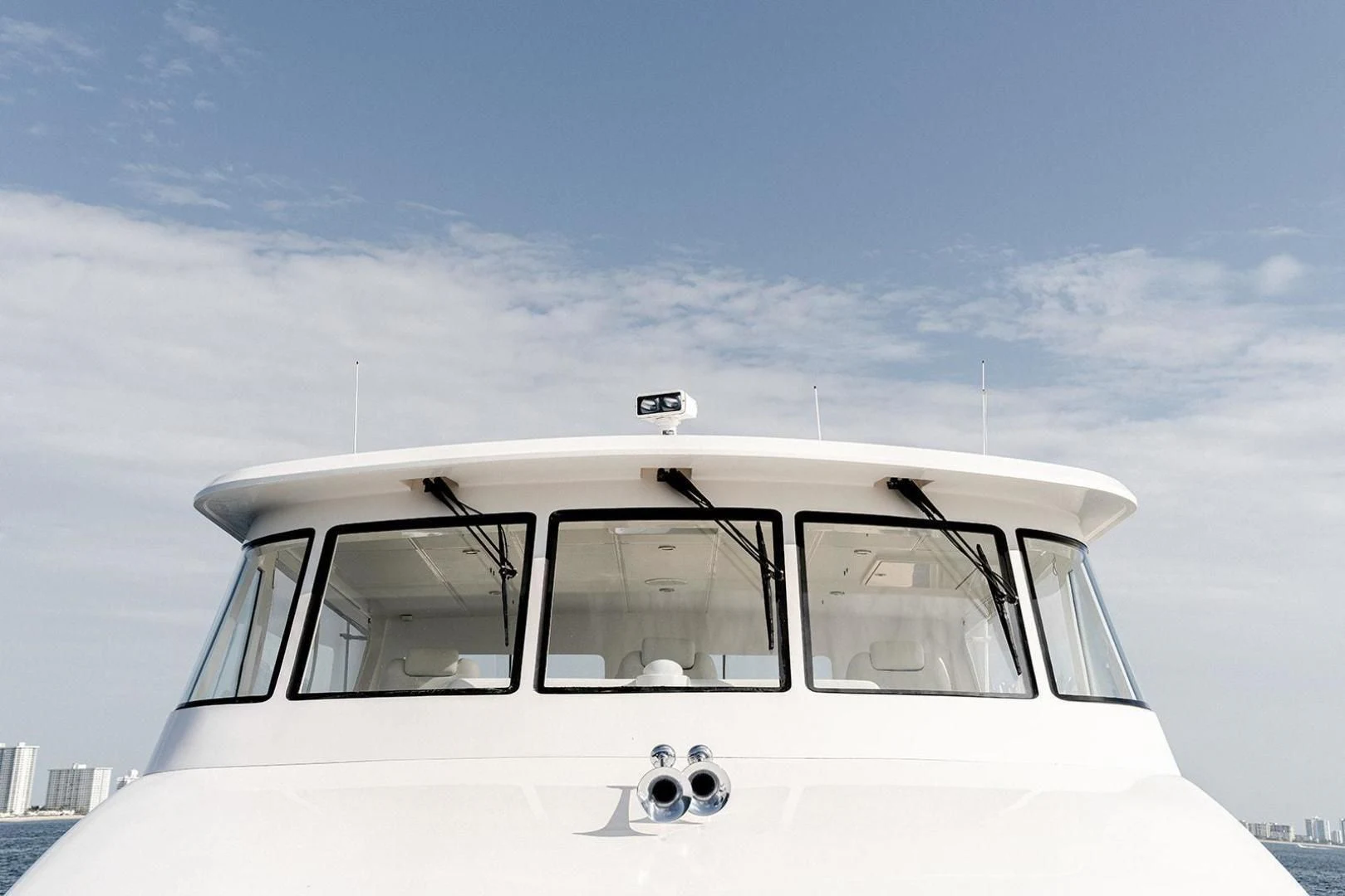 a white car with a door open aboard DREAM CATCHER Yacht for Sale
