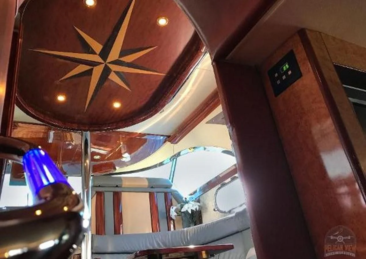 a large clock hangs from the ceiling aboard DREAM CATCHER Yacht for Sale
