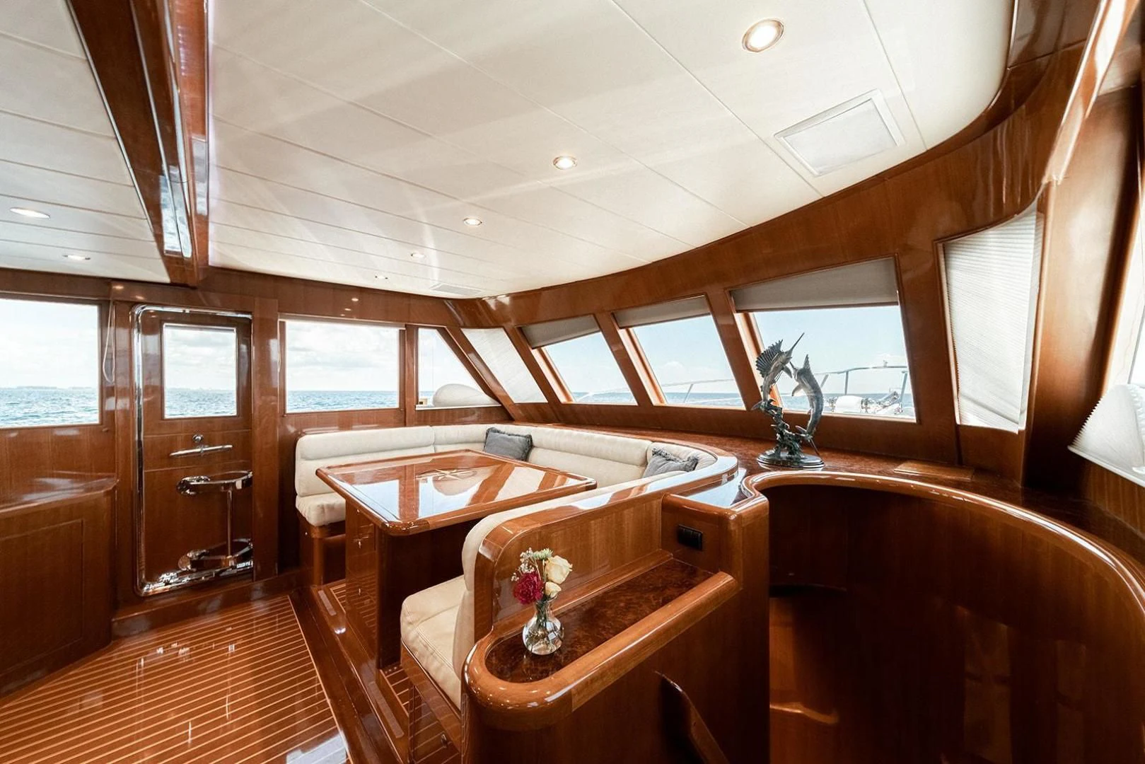 a room with a table and chairs aboard DREAM CATCHER Yacht for Sale