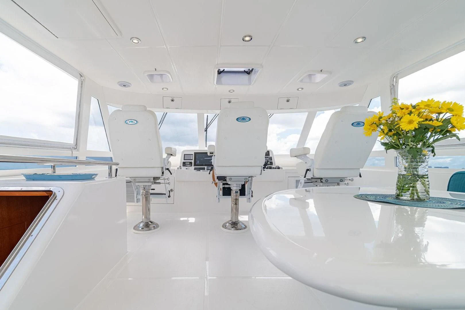 a room with a table and chairs aboard DREAM CATCHER Yacht for Sale