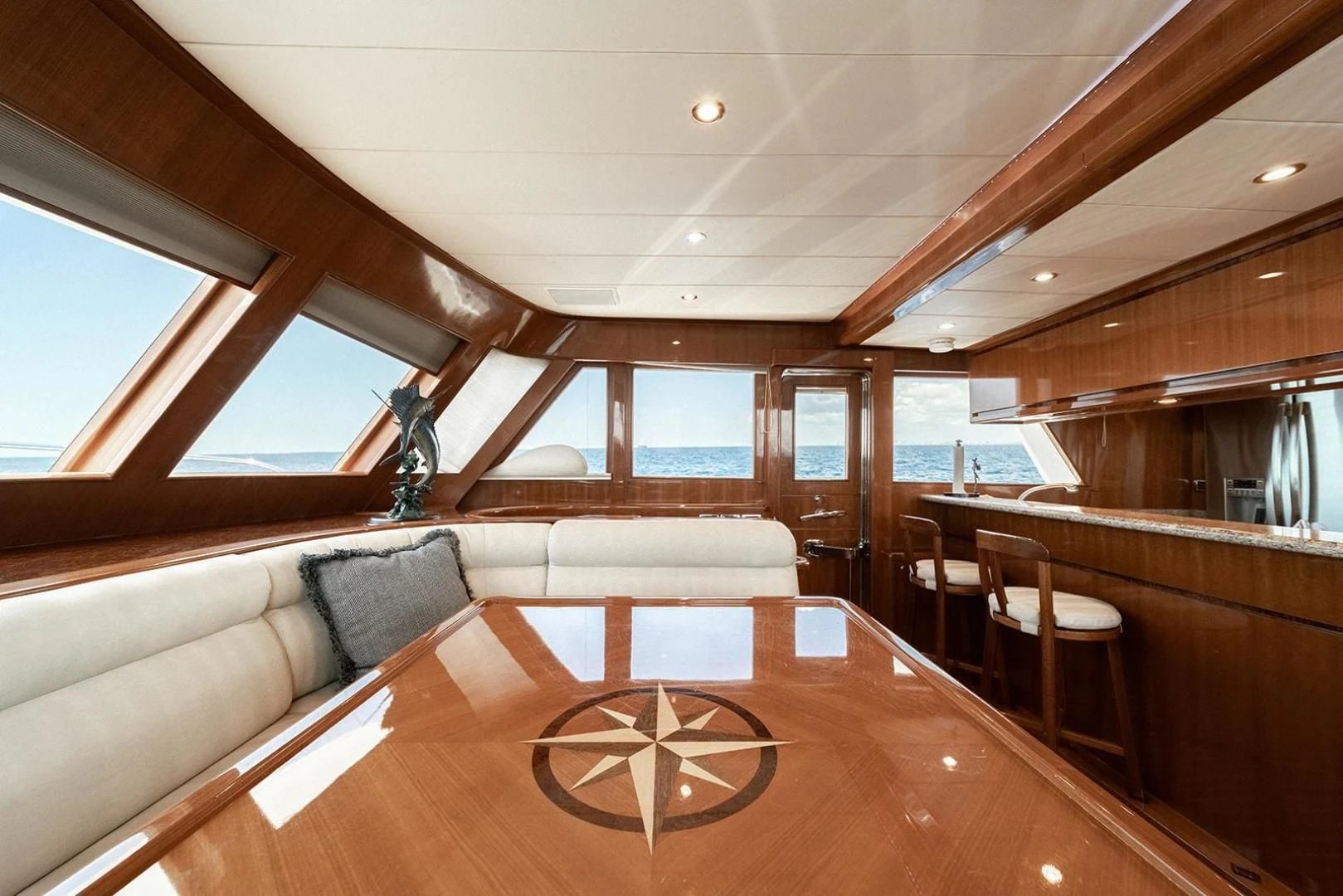 a room with a couch and a table and chairs aboard DREAM CATCHER Yacht for Sale