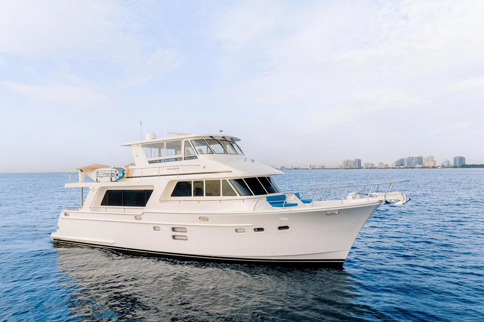 a white yacht on the water aboard DREAM CATCHER Yacht for Sale