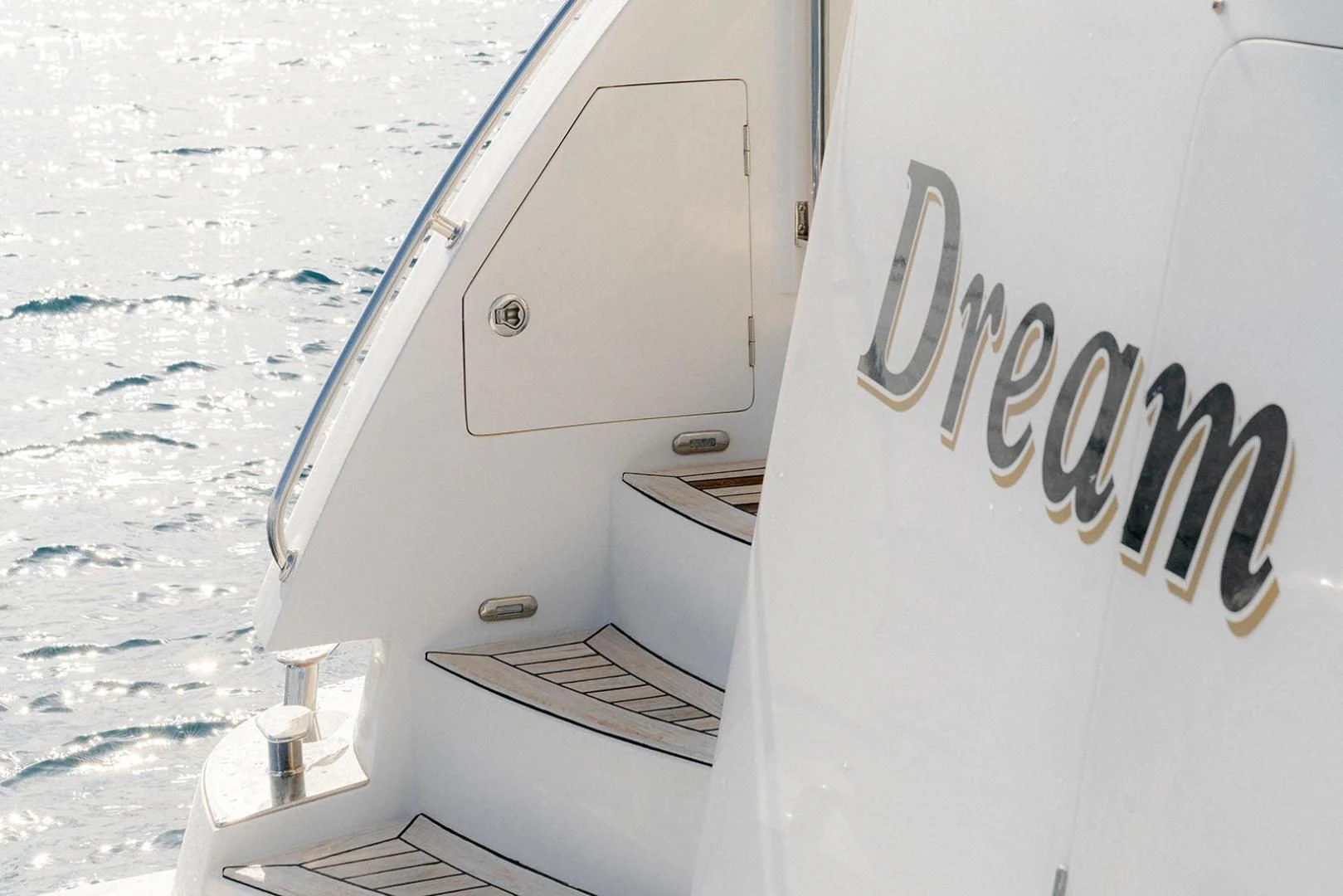 a white boat with a sign on the front aboard DREAM CATCHER Yacht for Sale