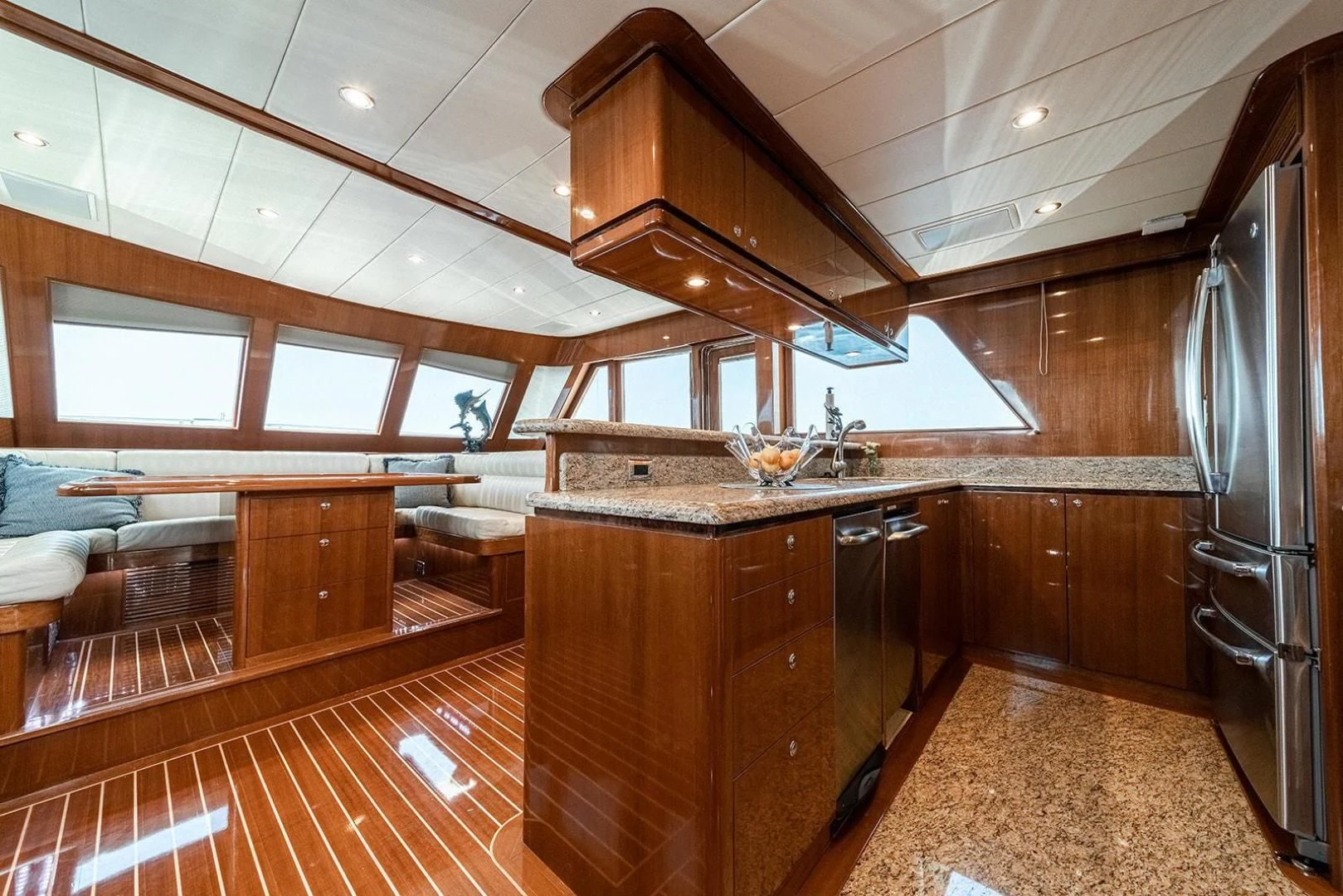 a kitchen with wooden cabinets aboard DREAM CATCHER Yacht for Sale