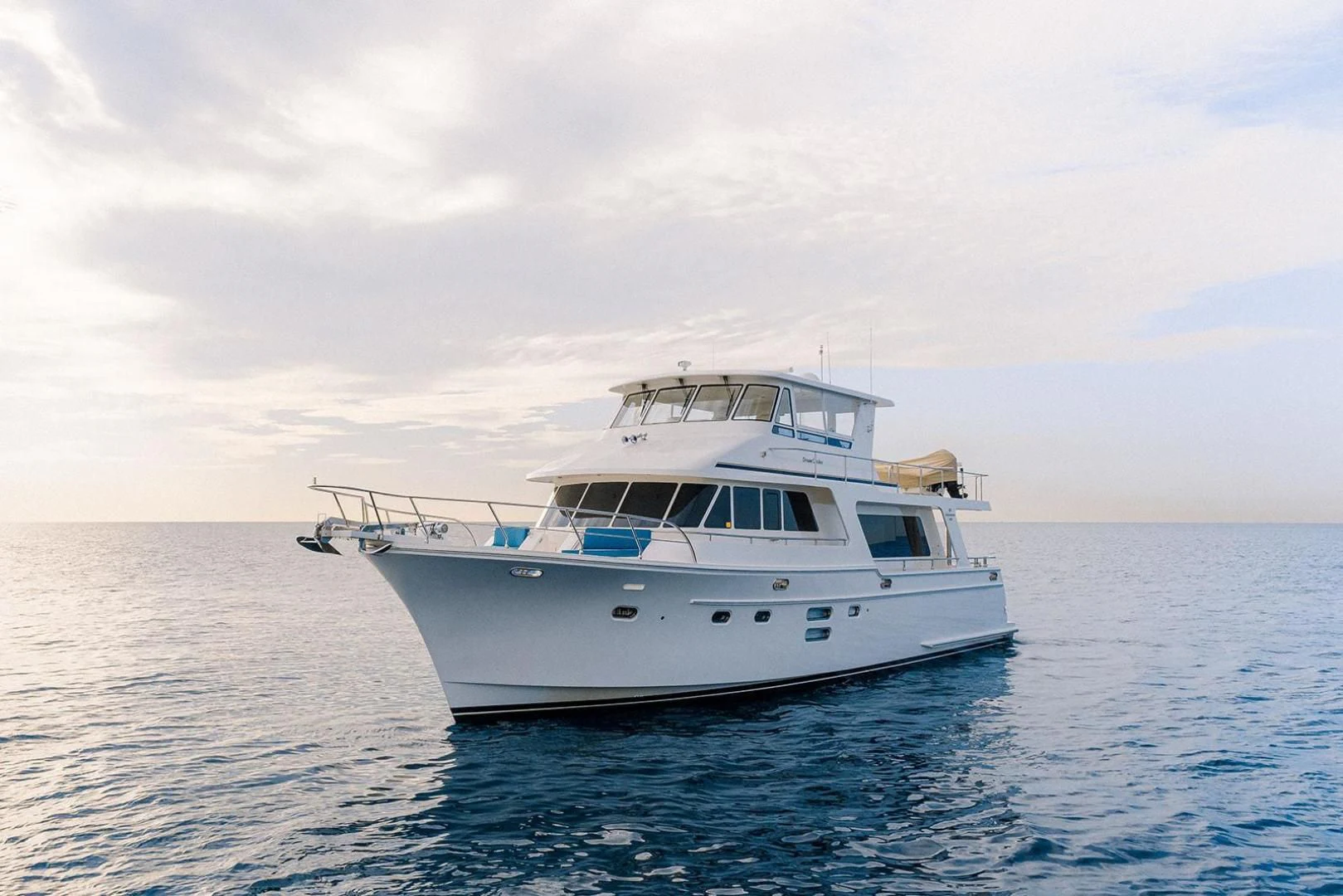 a white boat in the water aboard DREAM CATCHER Yacht for Sale