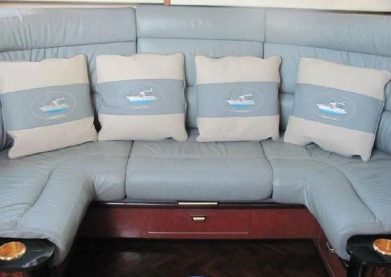 a group of white pillows on a couch aboard DREAM CATCHER Yacht for Sale