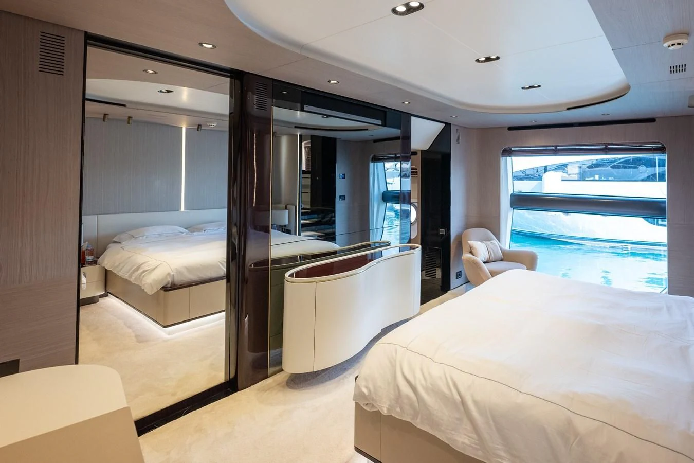 a room with a bed and a desk aboard CLOUDY BAY Yacht for Sale