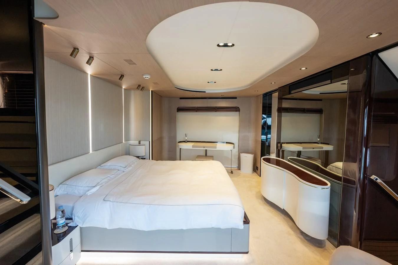 a room with a bed and a table aboard CLOUDY BAY Yacht for Sale