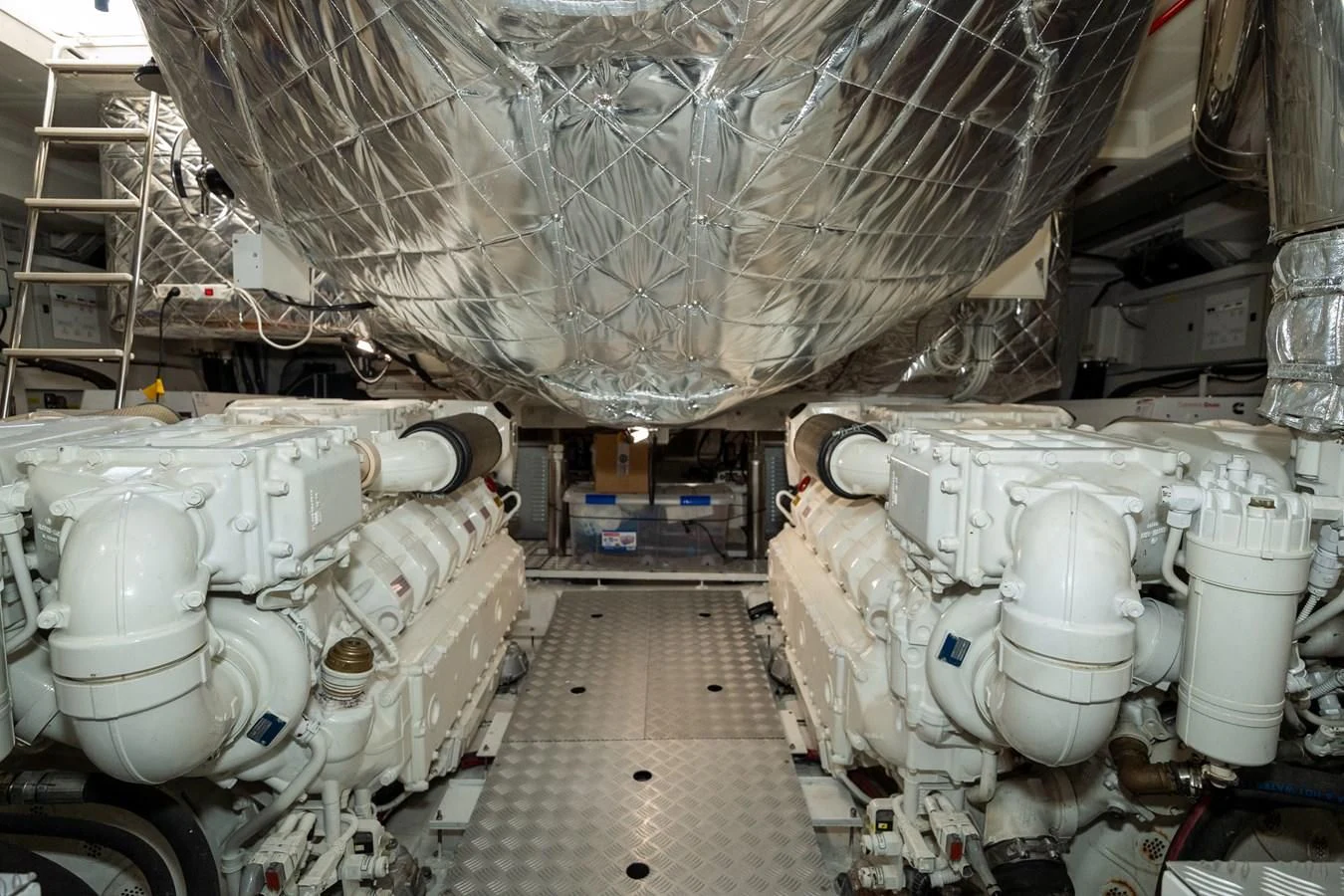 a large room with large pipes aboard CLOUDY BAY Yacht for Sale