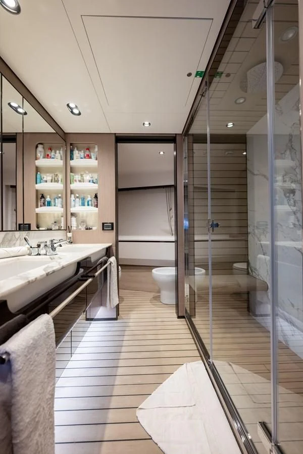 a bathroom with a shower unit and sink aboard CLOUDY BAY Yacht for Sale