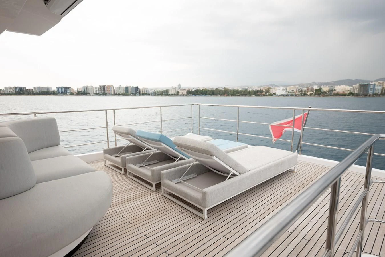 a deck with a flag on it aboard CLOUDY BAY Yacht for Sale