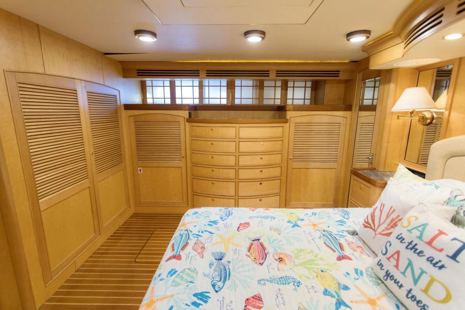 a bedroom with a bed and a closet aboard SOMEDAY CAME Yacht for Sale