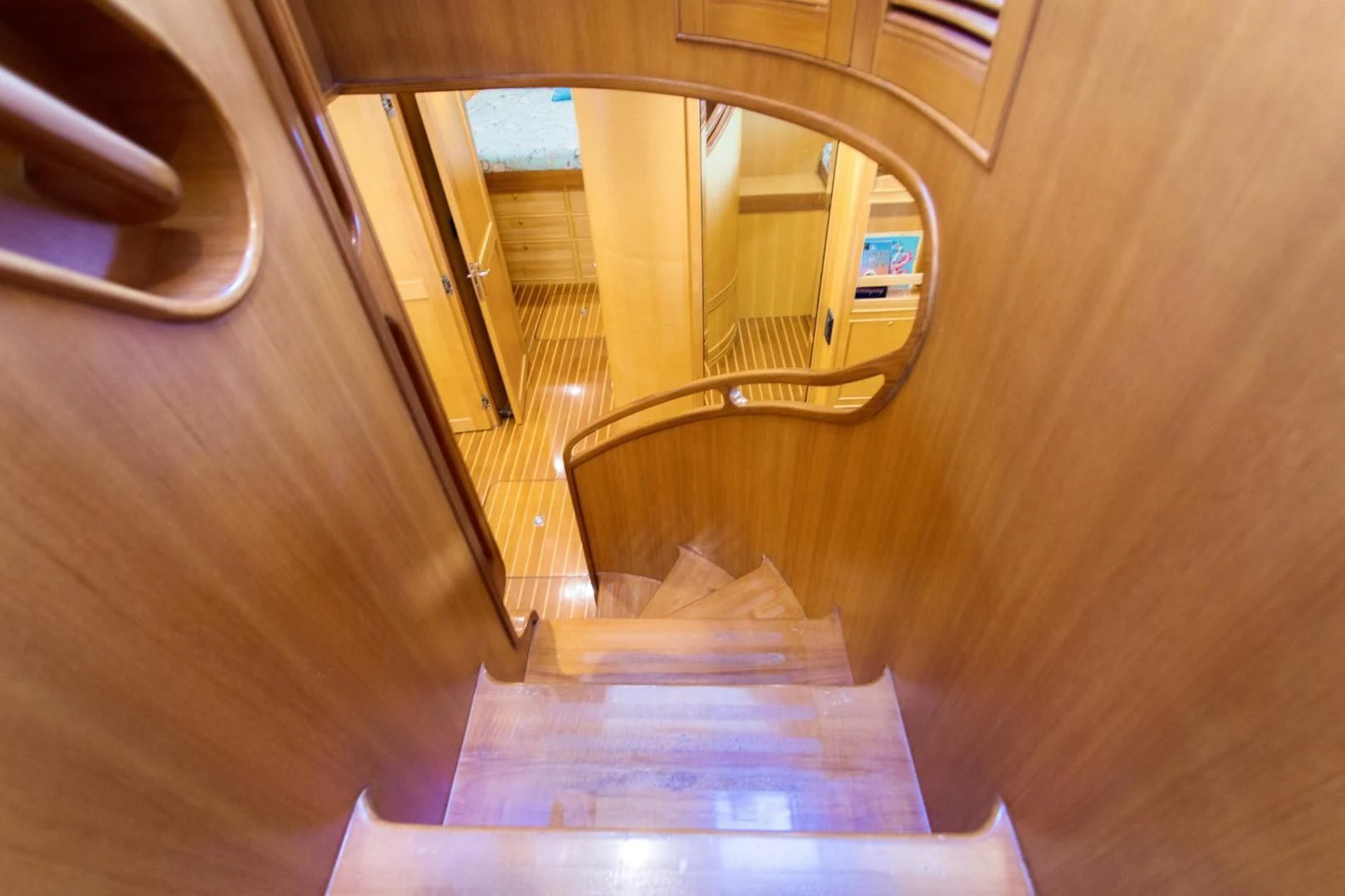 a hallway with a wood floor aboard SOMEDAY CAME Yacht for Sale